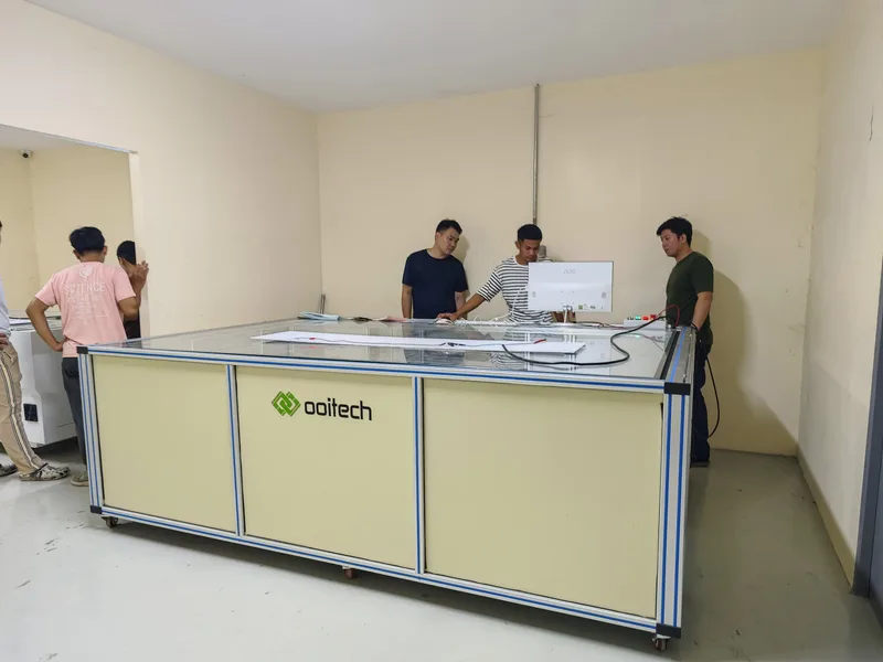 Snail Trails on Solar Panels: Causes and Prevention Offline solar module EL inspection station with a glass stage where modules are loaded by hand