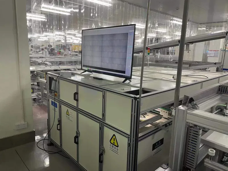 Snail Trails on Solar Panels: Causes and Prevention Inline solar module EL inspection station in a clean room with the electroluminescence image displayed on a monitor