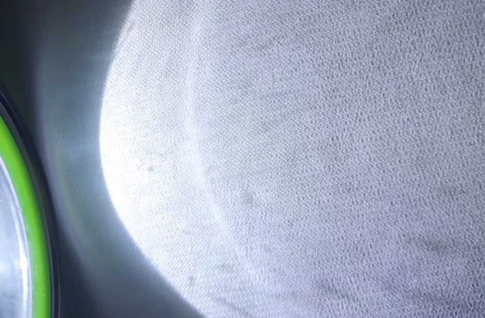 Close up of textured solar glass surface showing the regular embossed micro pattern
