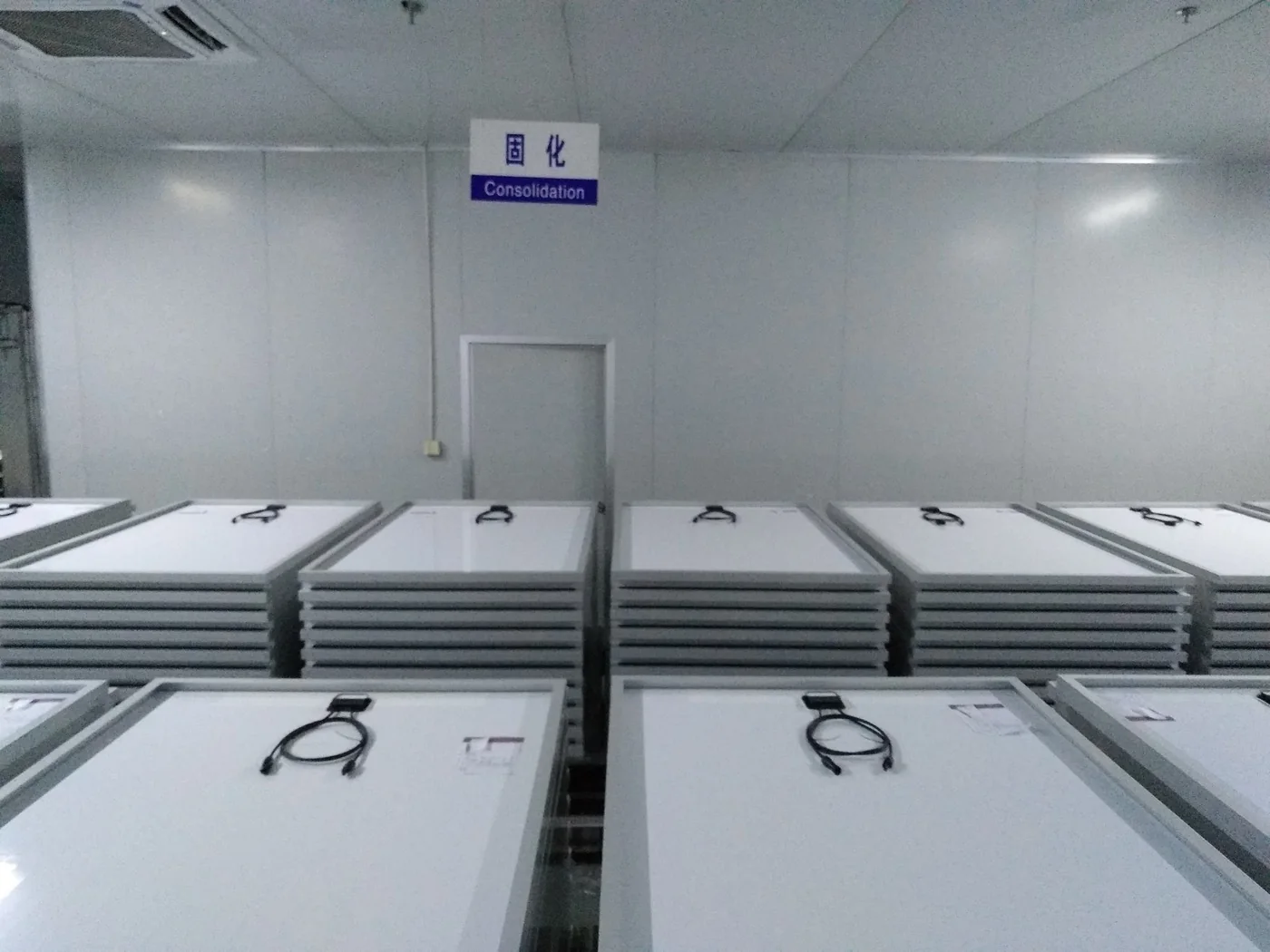 Stacked solar modules in a factory consolidation area